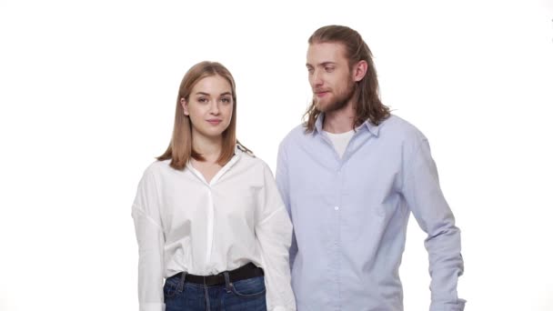 Young man gives his lady a bunch of roses over white isolated background. — Stock Video