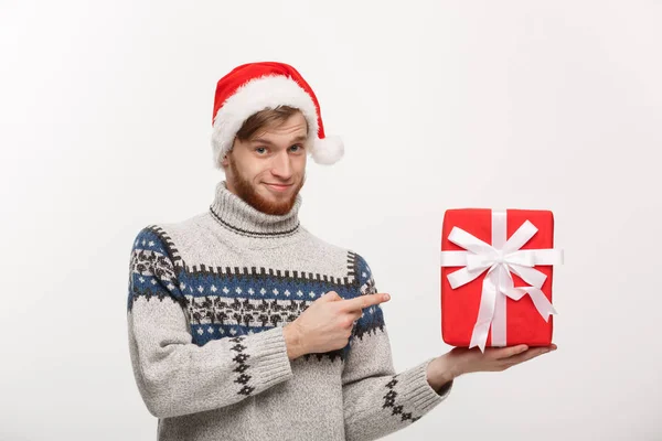 Weihnachtskonzept - glücklicher junger Mann mit erhobenem Zeigefinger auf weißem Hintergrund. — Stockfoto