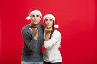 Noel kavramı - üfleme portre sevimli çift kamera için Noel günü dilek