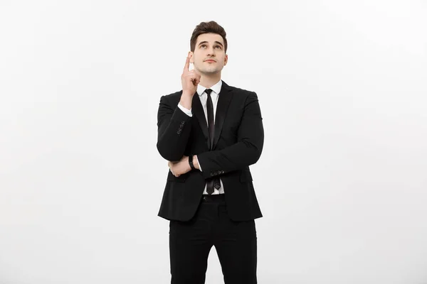 Businessconcept: Knappe zakenman met een vinger wijst omhoog geïsoleerd op witte achtergrond — Stockfoto