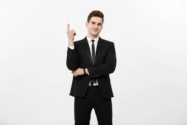 Conceito de negócio: Empresário bonito com um dedo apontado para cima isolado sobre fundo branco — Fotografia de Stock