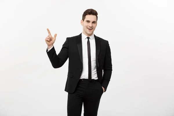Concepto de negocio: Hombre de negocios guapo con un dedo apuntando hacia arriba aislado sobre fondo blanco — Foto de Stock