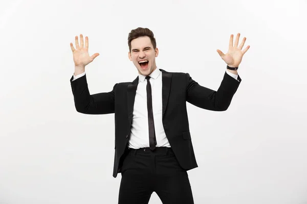 Concepto de Negocio: Retrato hombre de negocios guapo expresando sorpresa y alegría levantando las manos, aislado sobre fondo blanco . — Foto de Stock