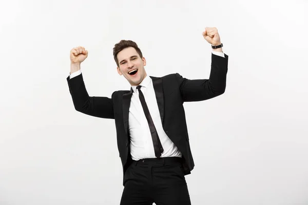 Concepto de Negocio: Retrato hombre de negocios guapo expresando sorpresa y alegría levantando las manos, aislado sobre fondo blanco . — Foto de Stock