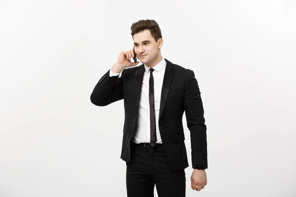 Schöner Geschäftsmann im Anzug telefoniert vor isoliertem weißen Hintergrund. — Stockfoto