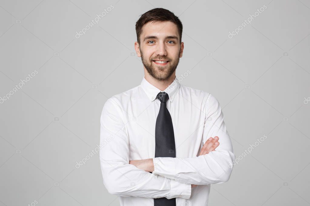 Business Concept - Young successful businessman posing over dark background. Copy space.