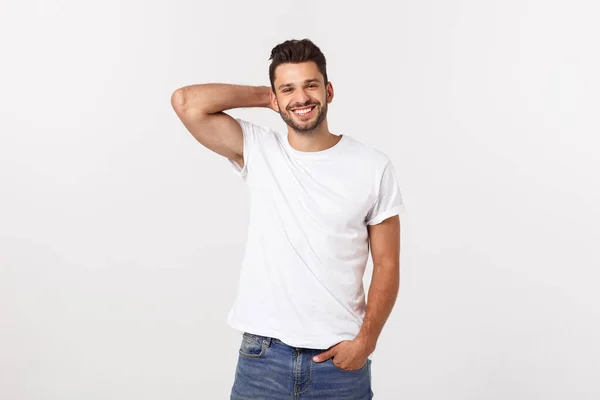 Portret van een knappe jongeman glimlachend tegen witte achtergrond — Stockfoto