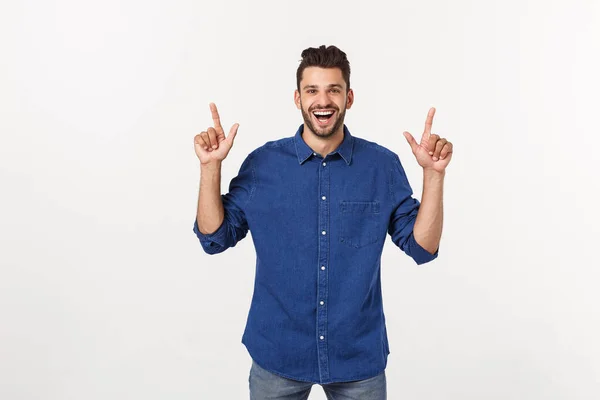 Man pointing showing copy space isolated on white background. Casual handsome Caucasian young man. — Stock Photo, Image