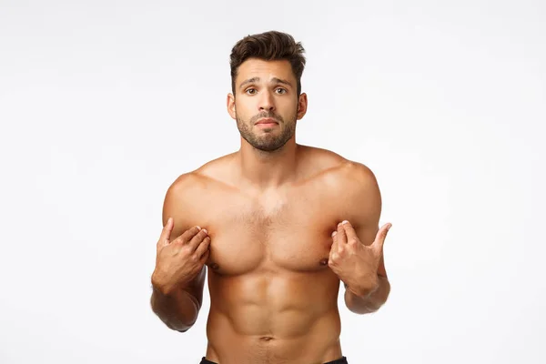 Cute upset, gloomy handsome shirtless sportsman with perfect body, six-packs abdominal abs, pointing himself, standing frustrated was accused something bad, posing distressed white background — Stock Photo, Image