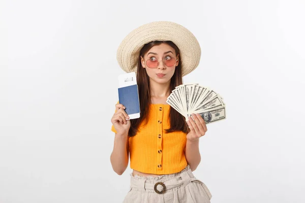 Portrait of cheerful, happy, laughing girl with hat on head, having money fan and passport with tickets in hands, isolated on white background — Stock Photo, Image