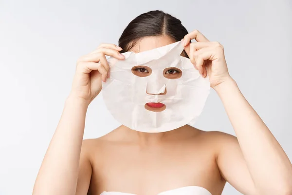 Spa, healthcare. Woman with purifying mask on her face isolated on white background. — Stock Photo, Image