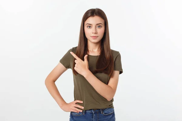 Portrait happy and surprised young lady standing isolated over grey background. Looking camera pointing. — Stock Photo, Image