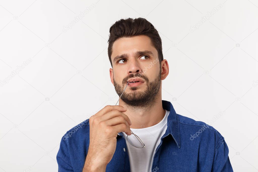 Close up of a guy wondering and get idea of business. Isolated over white background.