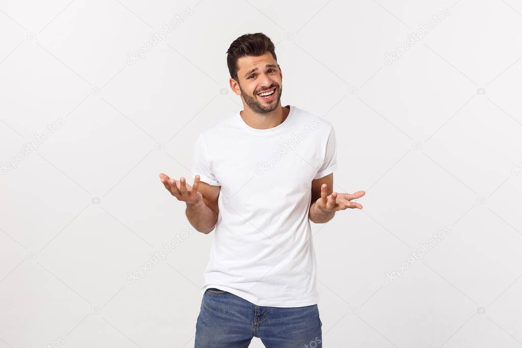 Charming handsome. Handsome young man in casual wear while standing isolated on white background