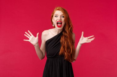Tensed and aggressive, pissed-off young redhead woman found out best friend slept with her boyfriend, arguing having argument and confrontation on party, screaming at person, red background
