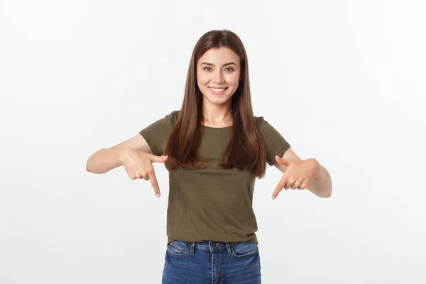 Portrait happy and surprised young lady standing isolated over grey background. Looking camera pointing. — Stock Photo, Image