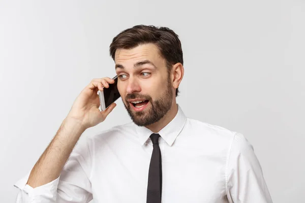 Young handsome business man calling using smartphone over isolated background with a happy face standing and smiling with a confident smile showing teeth. — Stock Photo, Image