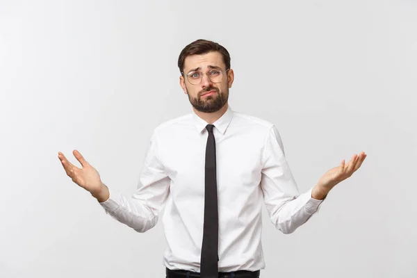 Jonge gelukkige zakenman gebaren met de handen en het tonen van evenwicht of niet schelen. — Stockfoto