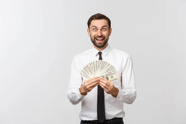 Fechar-se de alegre jovem empresário segurando dinheiro sobre fundo branco . — Fotografia de Stock