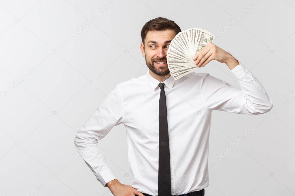 Portrait of a business man holding money, isolated on white.