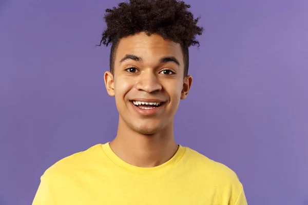 Close-up portrait of cheerful smiling man looking happy, express enthusiastic optimistic emotions, seeing something pleasant and interesting, standing purple background — Stock Photo, Image