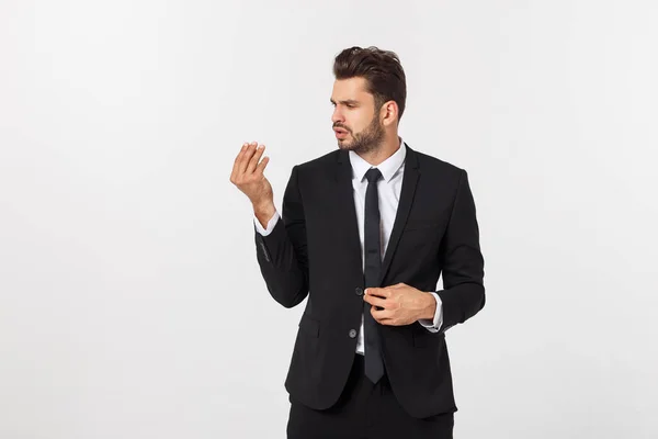 Portret van zelfverzekerde volwassen zakenman in formals staan geïsoleerd over witte achtergrond — Stockfoto
