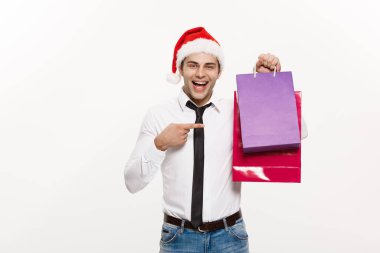 Noel Kavramı - Yakışıklı İş adamı Mutlu Noeller kutlar ve Noel Baba kırmızı büyük çantalı şapka giyer.