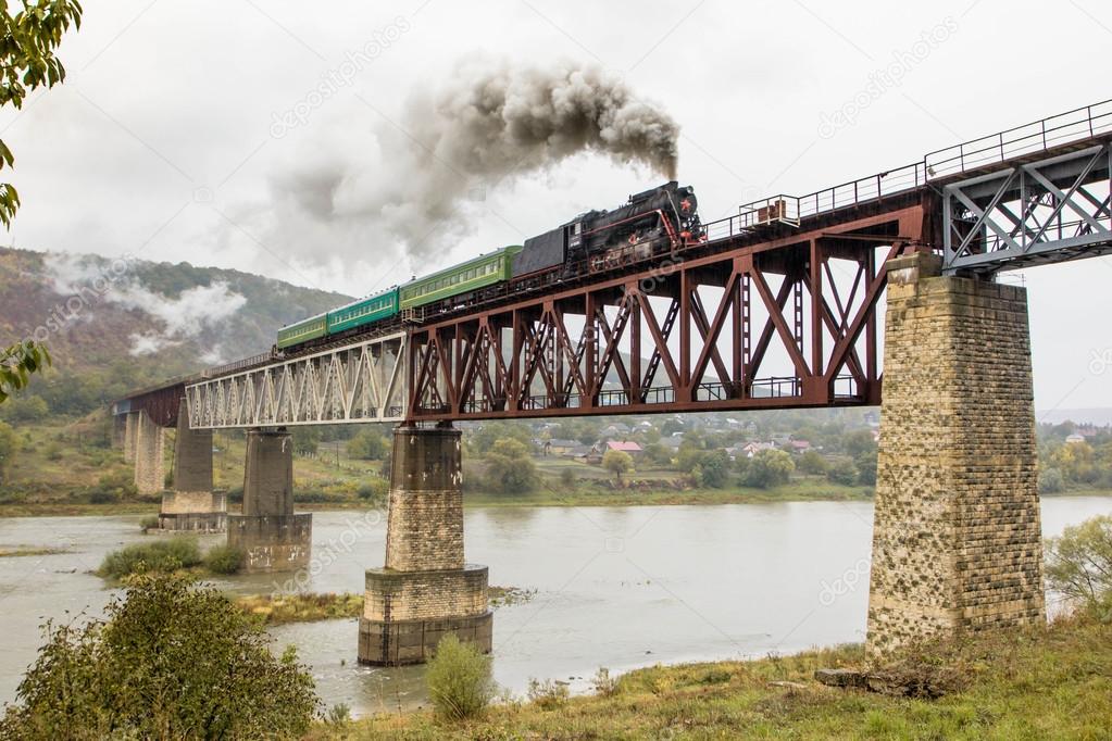 Steam train on the bridge in Zalischyky. Ukraine, Europe.