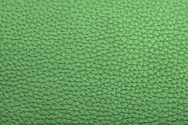 Green textured faux leather background — Stock Photo, Image