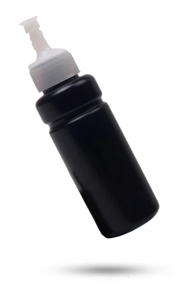 白地にインクジェットプリンタ用の黒インクボトル — ストック写真