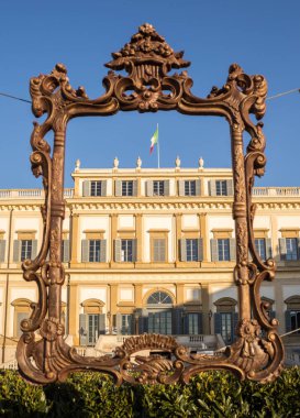 Bronze empty frame in front of Villa Reale of Monza, Italy clipart
