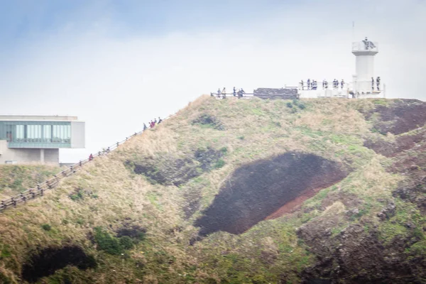 Lighthouse, the target of treking in Seopjikoji of Jeju island, South Korea — Stock Photo, Image