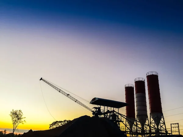 Cement concrete mixing production factory in silhouette light — Stock Photo, Image