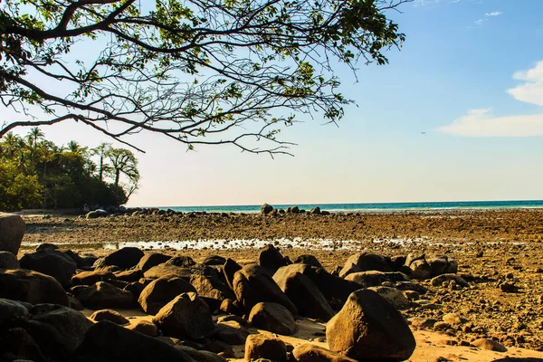 Beautiful Rock Stones Beach Sea Water Receded Dramatic Blue Sky — Stock Photo, Image