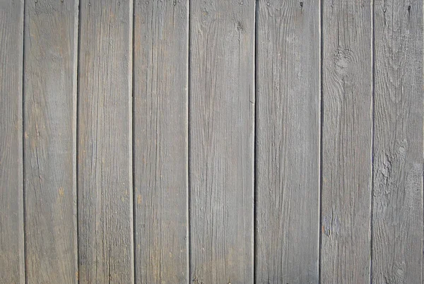 Grauer alter Holzzaun. Holz Palisade Hintergrund. Textur der Bohlen — Stockfoto