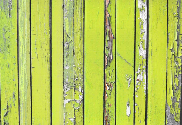 yellow, lemon old wooden fence. wood palisade background. planks texture