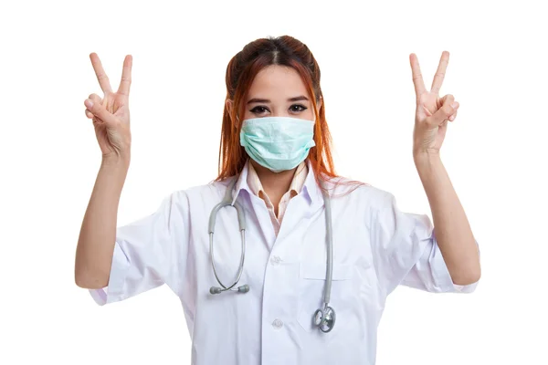 Young Asian female doctor show victory sign with both hands. — Stock Photo, Image