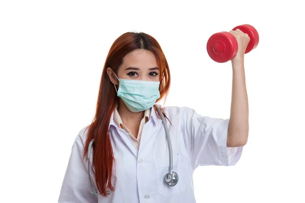 Young Asian female doctor wear mask with dumbbell. — Stock Photo, Image