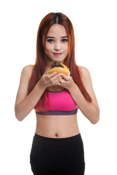 Krásná Asiatka zdravé těšit jíst hamburger. — Stock fotografie