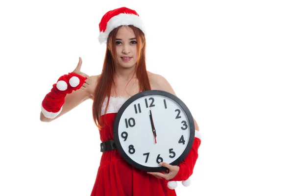 Asiatiska jul jultomten flicka tummen upp och klockan på midnigh — Stockfoto