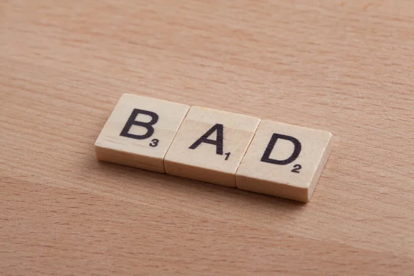 Scrabble letters spelling the word bad.