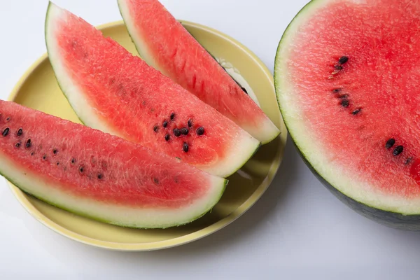 Cut watermelon on dish ready to eat — Stock Photo, Image