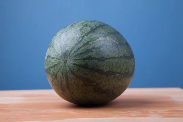 Watermelon on wooden table — Stock Photo, Image