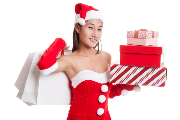 Asiatisches Weihnachtsmann-Mädchen mit Einkaufstaschen und Geschenk. — Stockfoto