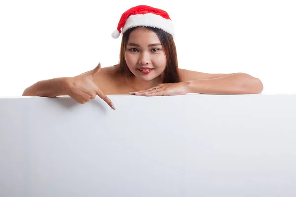 Asiático Natal Papai Noel menina apontar para baixo para sinal em branco . — Fotografia de Stock