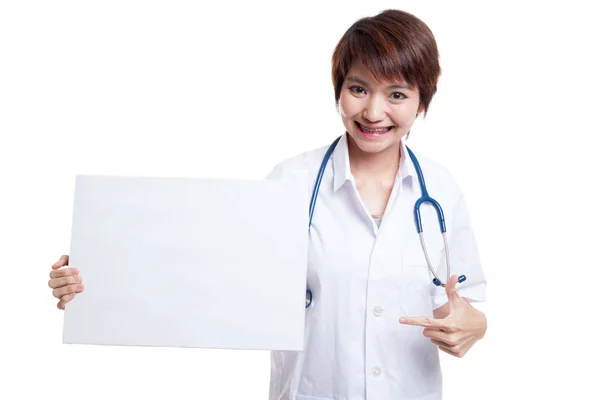 Young Asian female doctor point to a blank sign. — Stock Photo, Image