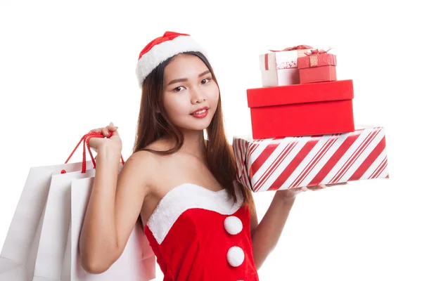 Asiatisches Weihnachtsmann-Mädchen mit Einkaufstaschen und Geschenk. — Stockfoto