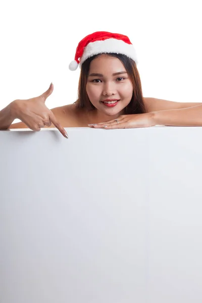 Asiatische Weihnachten Weihnachtsmann Mädchen zeigen nach unten auf leeres Zeichen. — Stockfoto