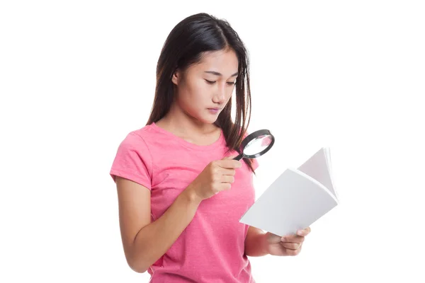 Asian woman with a book and magnifying glass — Stock Photo, Image