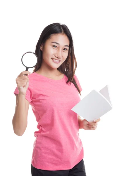 Asian woman with a book and magnifying glass — Stock Photo, Image